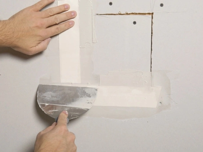 Drywall crack repair with joint compound